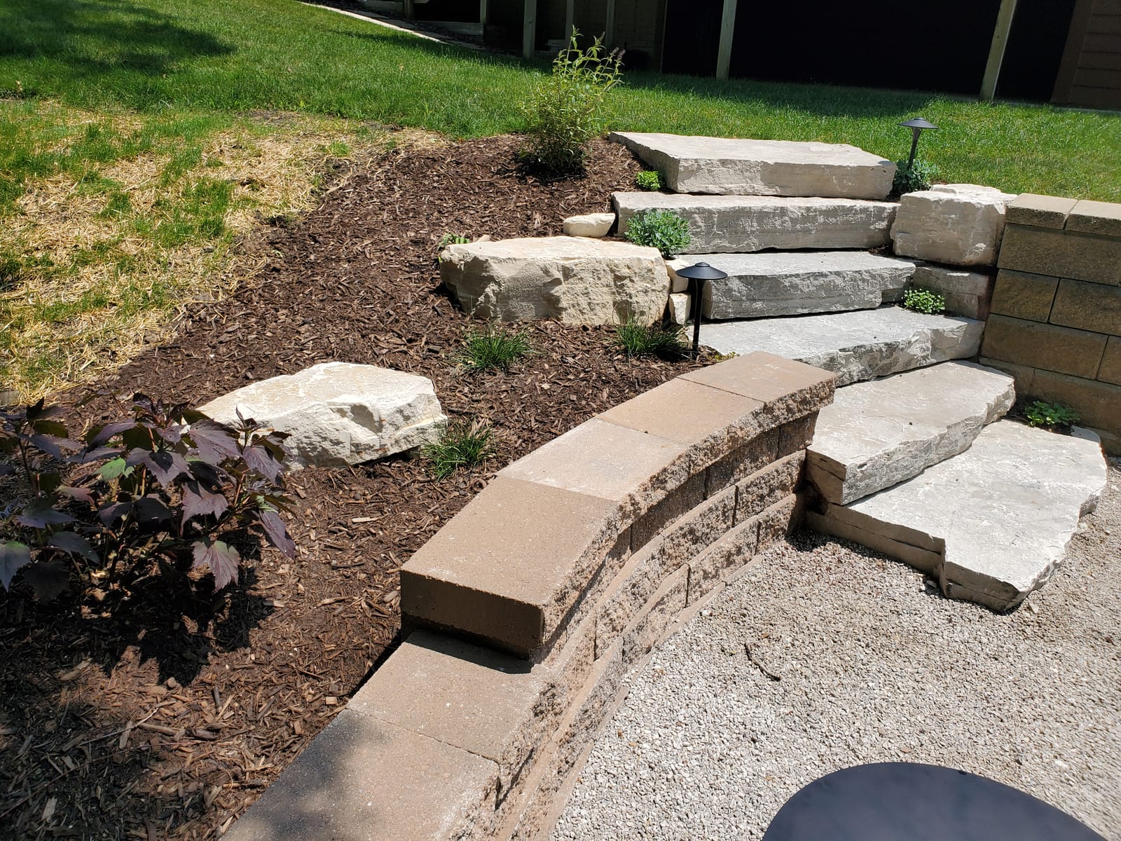 Stone stairs with plantings and landscape lighting